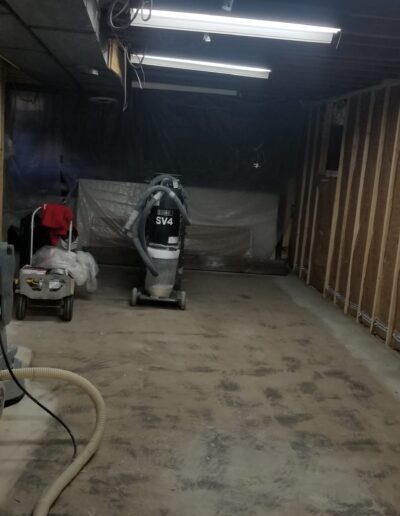 A room with a vacuum showcasing a clean, finished surface after epoxy floor coating NYC service.